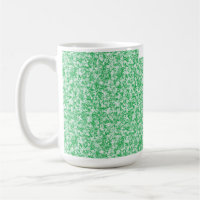 A lush, green fern with delicate, arching fronds f