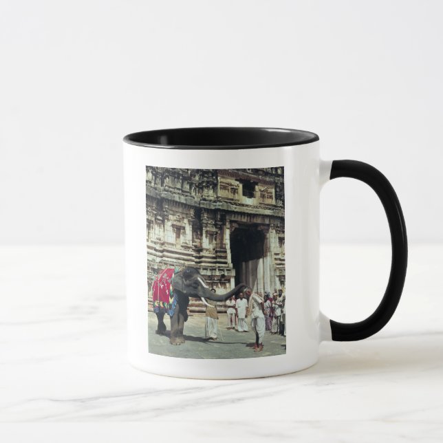 A man being blessed by an elephant mug (Right)