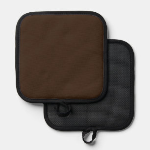 a man in a suit and tie standing in front of a bro pot holder