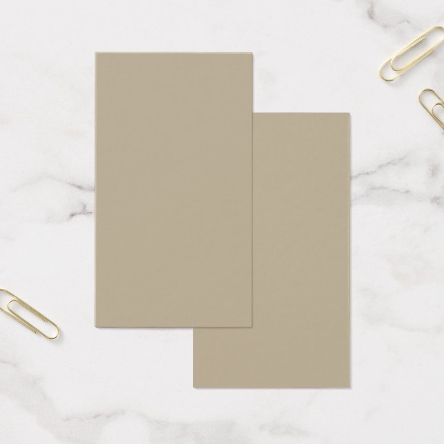 a man in a suit and tie standing in front of a wal (Office)