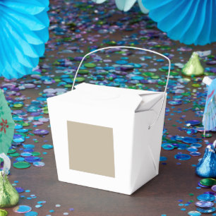 a man in a suit and tie standing in front of a wal favor box