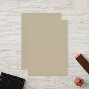 a man in a suit and tie standing in front of a wal loyalty card