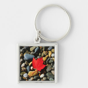 A Maple leaf on a Rock Background Keychain