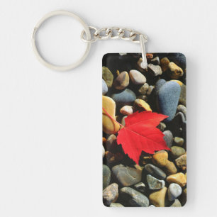 A Maple leaf on a Rock Background Keychain