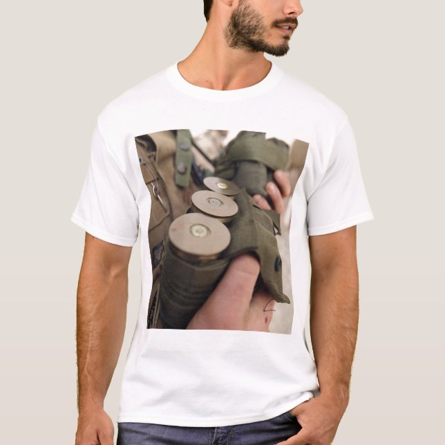 A Marine cradles handfuls of 40 mm grenades T-Shirt (Front)
