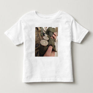 A Marine cradles handfuls of 40 mm grenades Toddler T-shirt