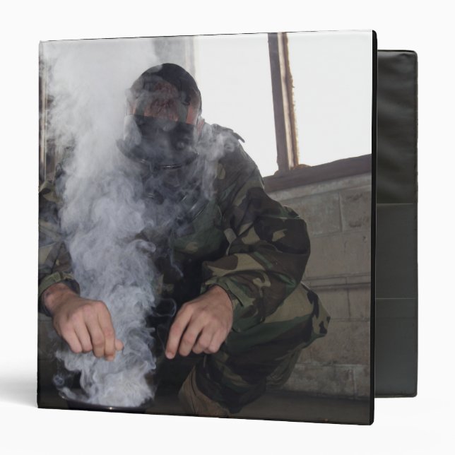 A marine fills the gas chamber with more CS gas Binder (Front/Inside)