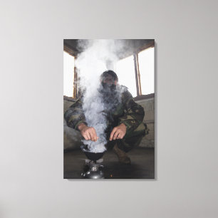 A marine fills the gas chamber with more CS gas Canvas Print