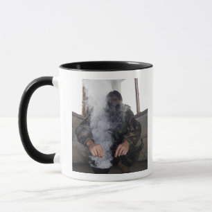 A marine fills the gas chamber with more CS gas Mug