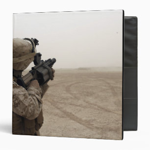 A Marine fires the M-32 Binder