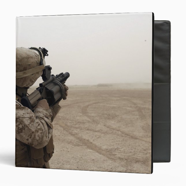A Marine fires the M-32 Binder (Front/Inside)
