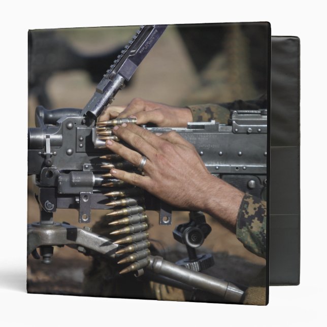 A Marine loads a M-240G machine gun Binder (Front/Inside)