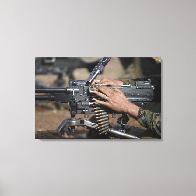 A Marine loads a M-240G machine gun Canvas Print (Front)