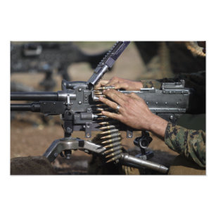 A Marine loads a M-240G machine gun Photo Print