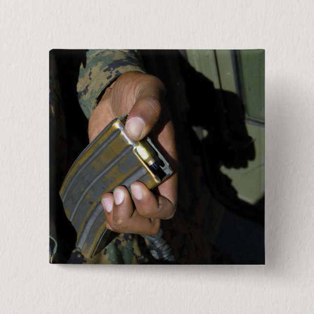 A Marine loads blank ammunition rounds 2 Inch Square Button (Front)