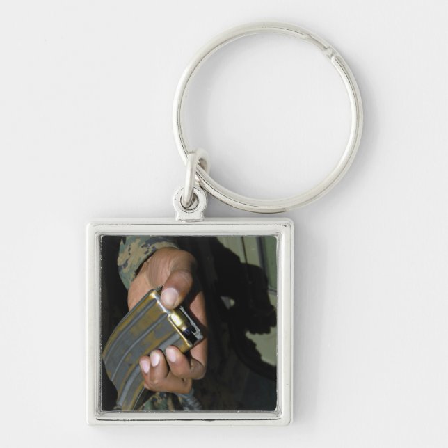 A Marine loads blank ammunition rounds Keychain (Front)