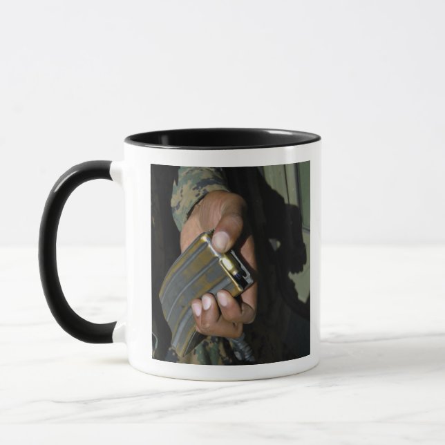 A Marine loads blank ammunition rounds Mug (Left)