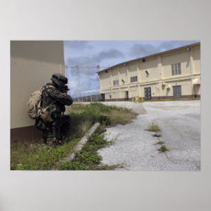 A Marine posts security Poster