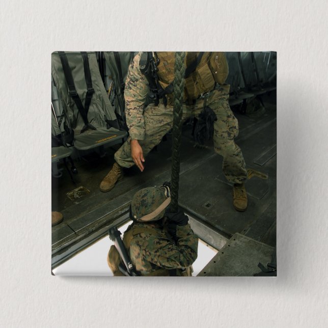 A Marine sends a fellow Marine down the hell ho 2 Inch Square Button (Front)