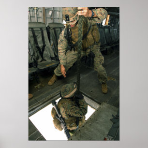 A Marine sends a fellow Marine down the hell ho Poster