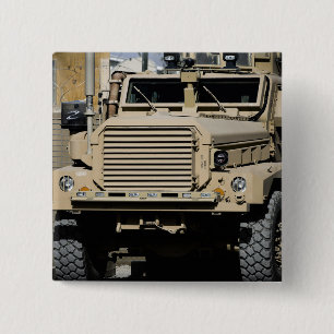 A mine-resistant, ambush-protected vehicle 2 inch square button