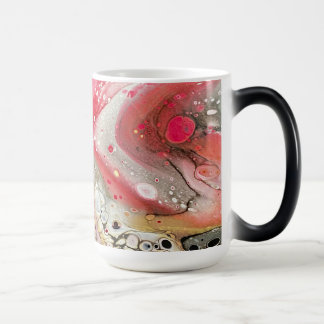 A mug with pink, gold, and black colours
