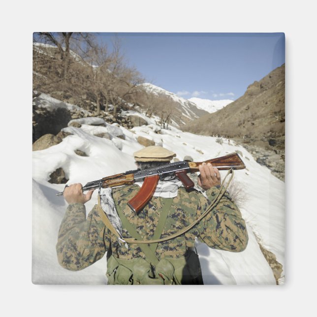 A Mujahadeen Guard walks with US Military membe Magnet (Front)
