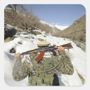 A Mujahadeen Guard walks with US Military membe Square Sticker