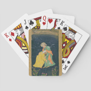 A Mullah bowing down to a man in Iranian dress who Playing Cards