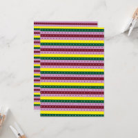 a multicolored striped background with dots