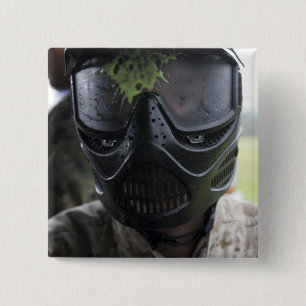 A paintball round 2 inch square button