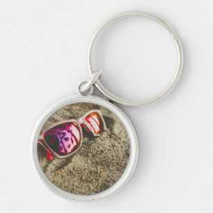 A Pair Of Fashionable Sunglasses On The Beach Keychain