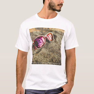 A Pair Of Fashionable Sunglasses On The Beach T-Shirt