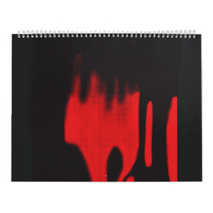 a pair of shoes sitting on top of a floor calendar