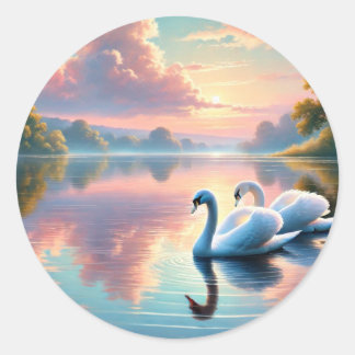 A pair of swans gliding on a serene lake classic round sticker