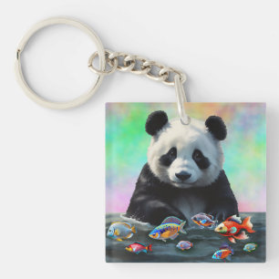 A Panda Gazes Curiously at Swimming Colorful Fish Keychain