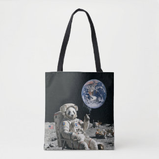 A panda smoking a cigarette on the moon tote bag