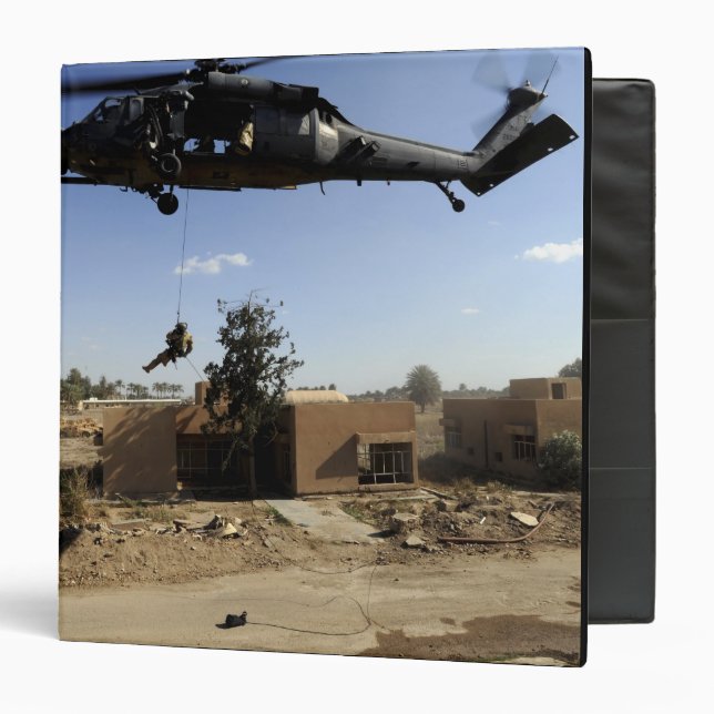 A pararescueman rappels from an HH-60 2 Binder (Front/Inside)