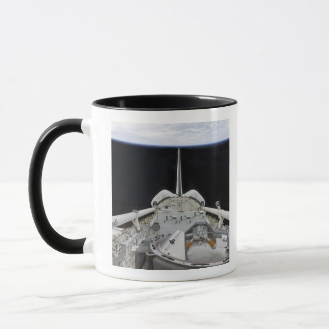 A partial view of Space Shuttle Mug (Left)