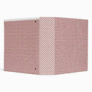 A patterned rug with red and brown motifs lies on  binder