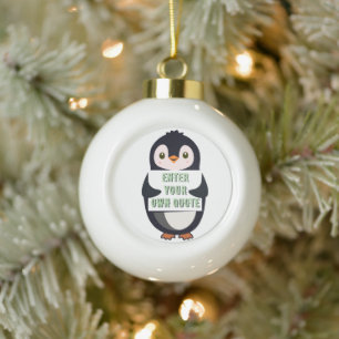 A penguin holding a sign with customizable text th ceramic ball christmas ornament