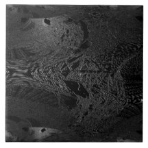 A piece of dark black ceramic with a space eminent