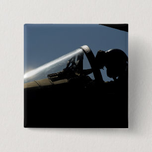 A pilot prepares for take-off 2 inch square button