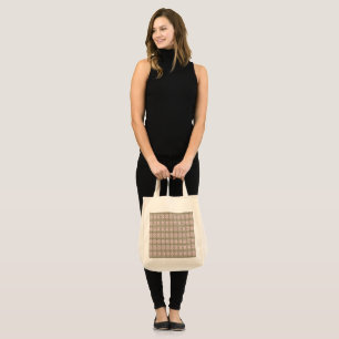 a pink and brown pattern on a white background tote bag