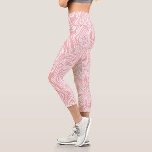 a pink and white abstract design on a white backgr capri leggings