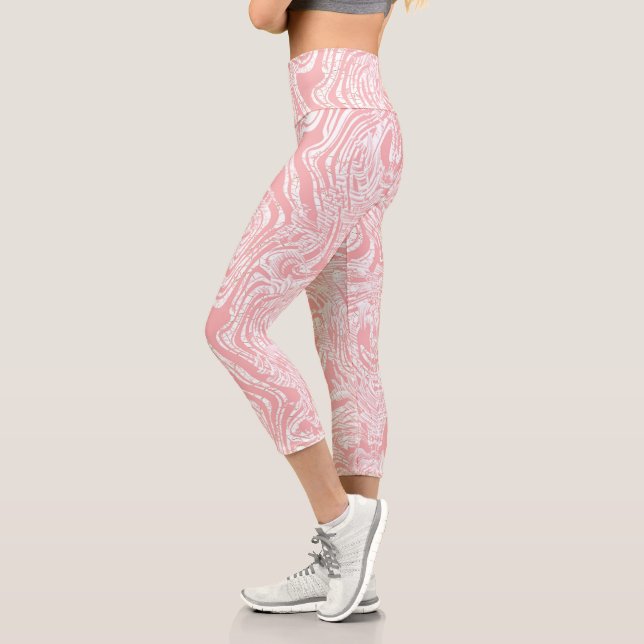a pink and white abstract design on a white backgr capri leggings (Left)