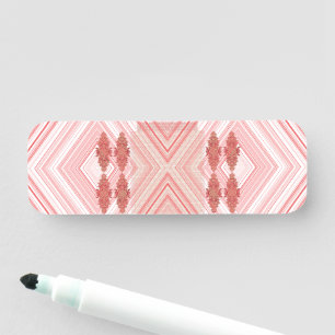 a pink and white background with a diamond pattern name tag