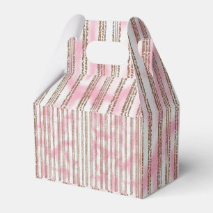 a pink and white striped background favor box