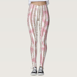 a pink and white striped background leggings