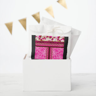 a pink and white wallpaper with a cross on it favour bag